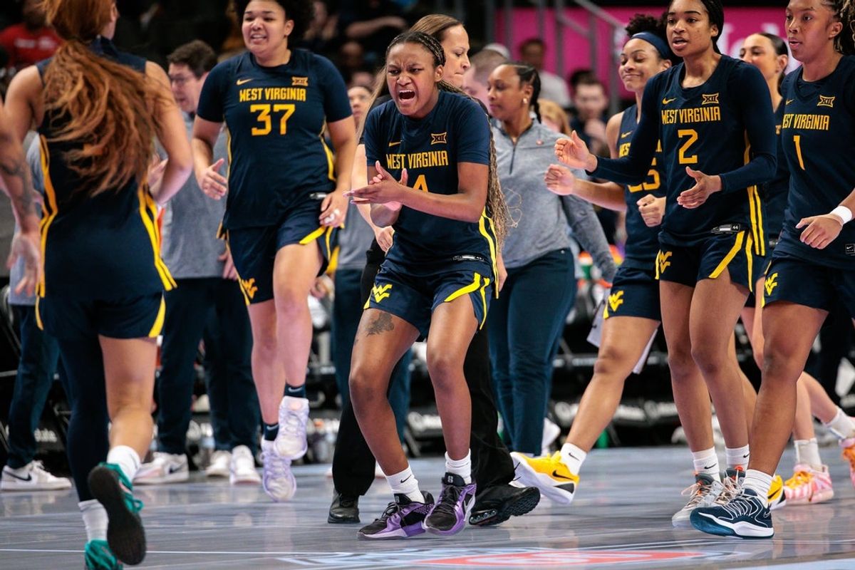Mar 8, 2026; Kansas City, MO, USA; West Virginia Mountaineers guard Madison Parrish (4) reacts to game play during the first half against the TCU Horned Frogs at T-Mobile Center. Mandatory Credit: William Purnell-Imagn Images