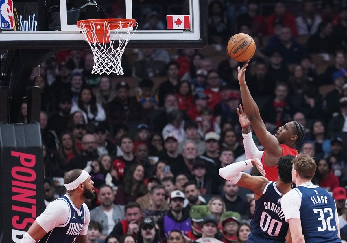 Mar 8, 2026; Toronto, Ontario, CAN; Toronto Raptors forward RJ Barrett (9) drives to the basket over Dallas Mavericks forward Cooper Flagg (32) during the first quarter at Scotiabank Arena. Mandatory Credit: Nick Turchiaro-Imagn Images