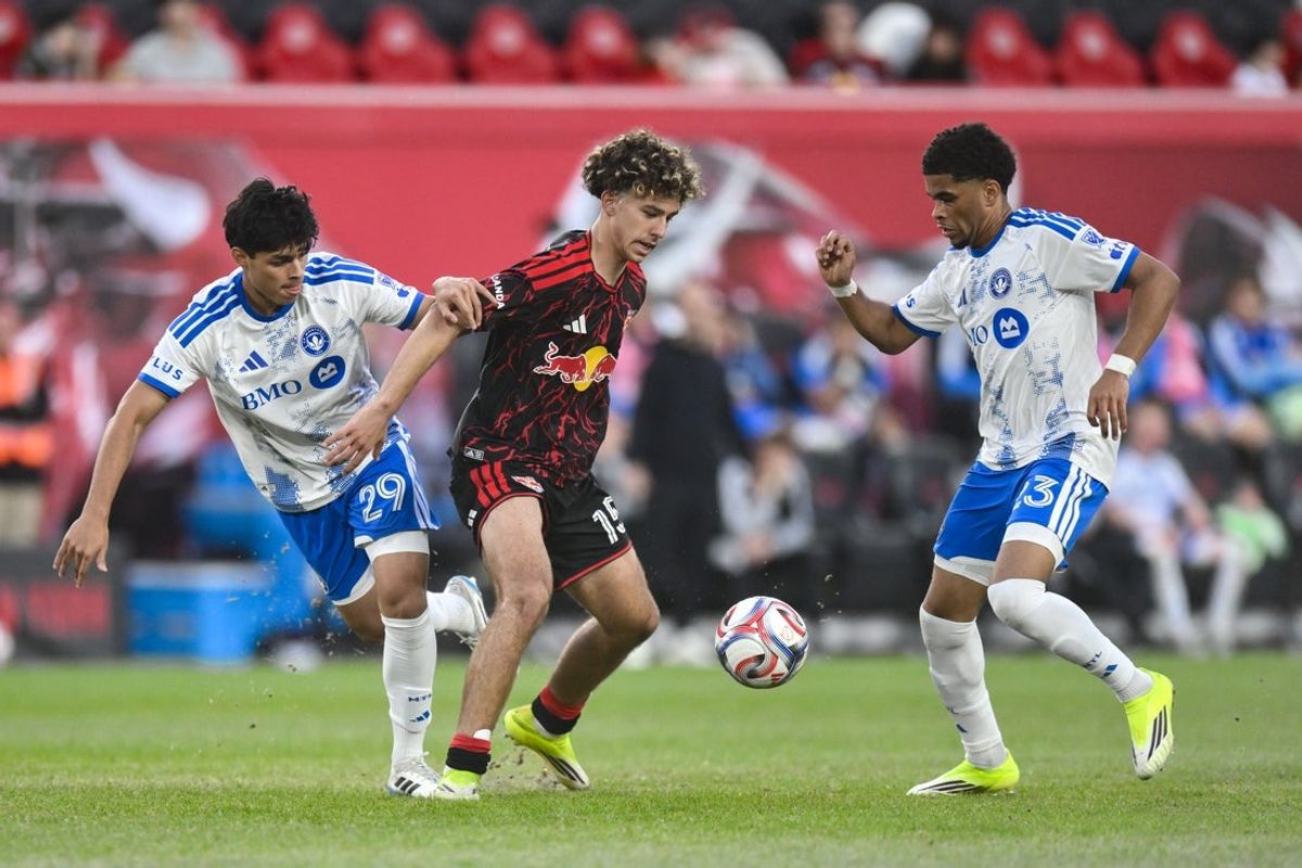 Mar 8, 2026; Harrison, New Jersey, USA; Red Bull New York midfielder Adri Mehmeti (15) tries to gain control of the ball against CF Montréal midfielder Olger Escobar (29) and forward Noah Streit (23) during the second half at Sports Illustrated Stadium. Mandatory Credit: John Jones-Imagn Images
