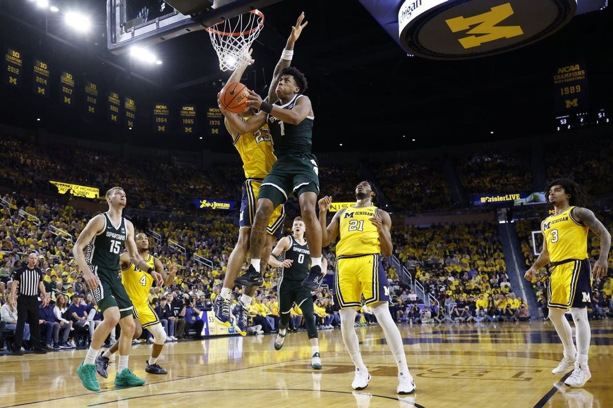 Mar 8, 2026; Ann Arbor, Michigan, USA;  Michigan State Spartans guard Jeremy Fears Jr. (1) shoots on Michigan Wolverines forward Yaxel Lendeborg (23) in the second half at Crisler Center. Mandatory Credit: Rick Osentoski-Imagn Images