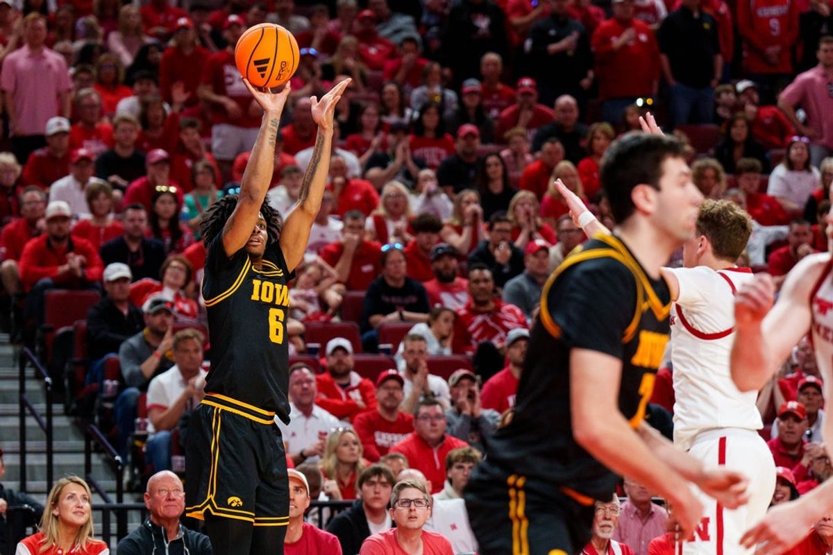 Mar 8, 2026; Lincoln, Nebraska, USA; Iowa Hawkeyes guard Tavion Banks (6) shoots a three-point basket against the Nebraska Cornhuskers during the second half at Pinnacle Bank Arena. Mandatory Credit: Dylan Widger-Imagn Images