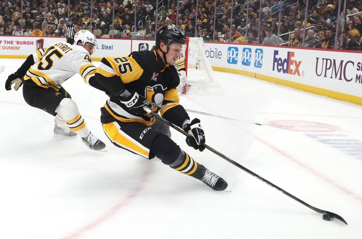 Mar 8, 2026; Pittsburgh, Pennsylvania, USA;  Pittsburgh Penguins right wing Elmer Soderblom (25) moves the puck against Boston Bruins defenseman Jonathan Aspirot (45) during the first period at PPG Paints Arena. Mandatory Credit: Charles LeClaire-Imagn Images