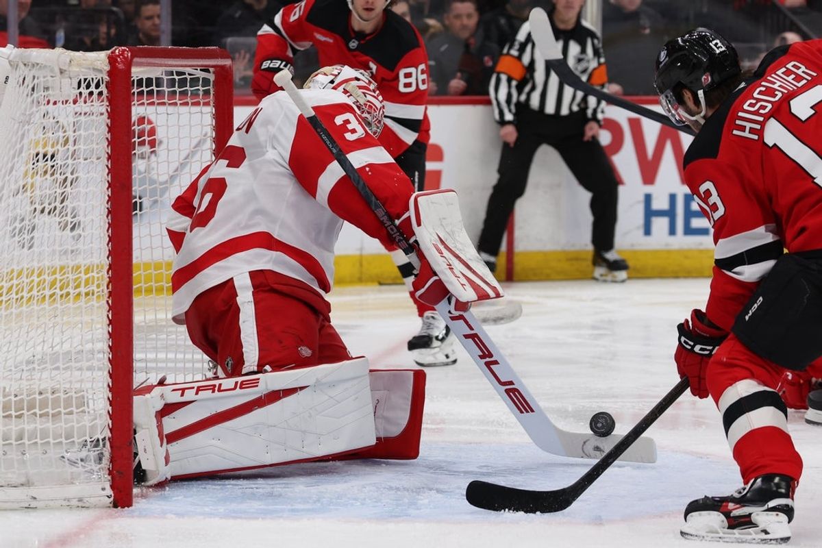 Mar 8, 2026; Newark, New Jersey, USA;  Detroit Red Wings goaltender John Gibson (36) uses his stick to make a stop against the New Jersey Devils during the second period at Prudential Center. Mandatory Credit: Thomas Salus-Imagn Images
