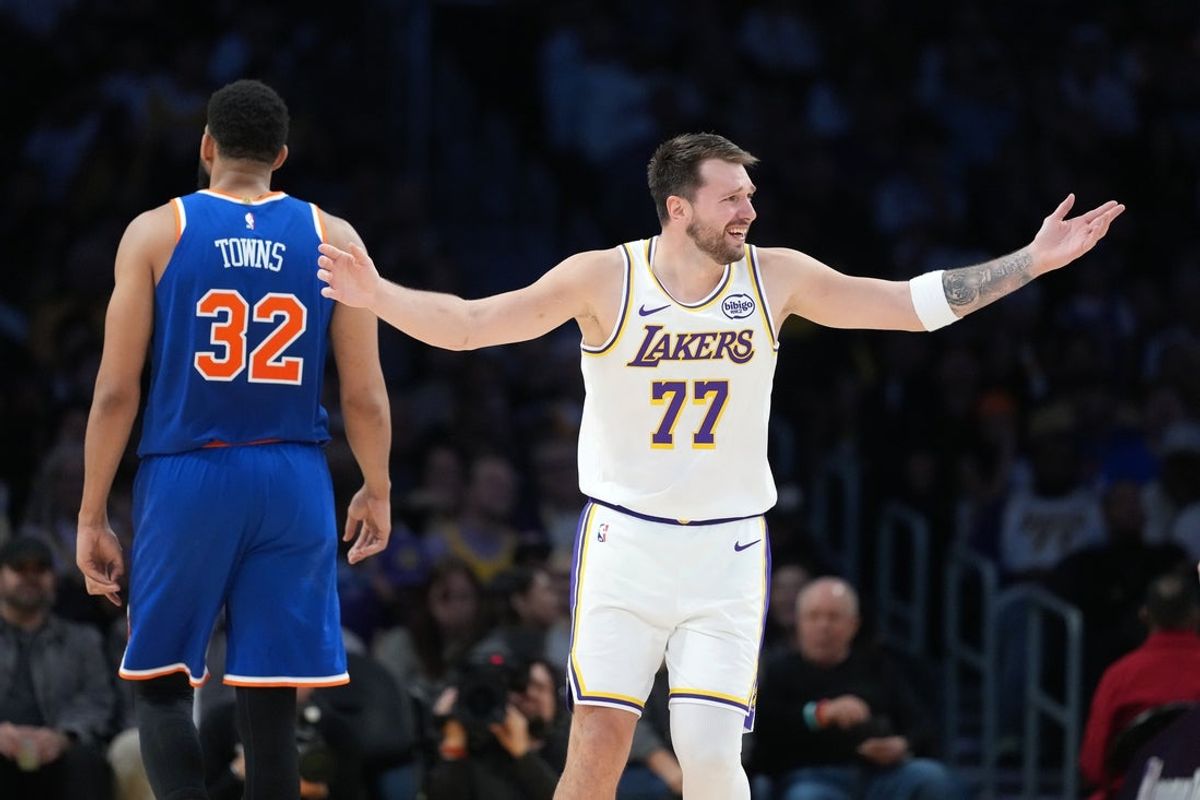 Mar 8, 2026; Los Angeles, California, USA; Los Angeles Lakers guard Luka Doncic (77) and New York Knicks center Karl-Anthony Towns (32) react in the second half at Crypto.com Arena. Mandatory Credit: Kirby Lee-Imagn Images