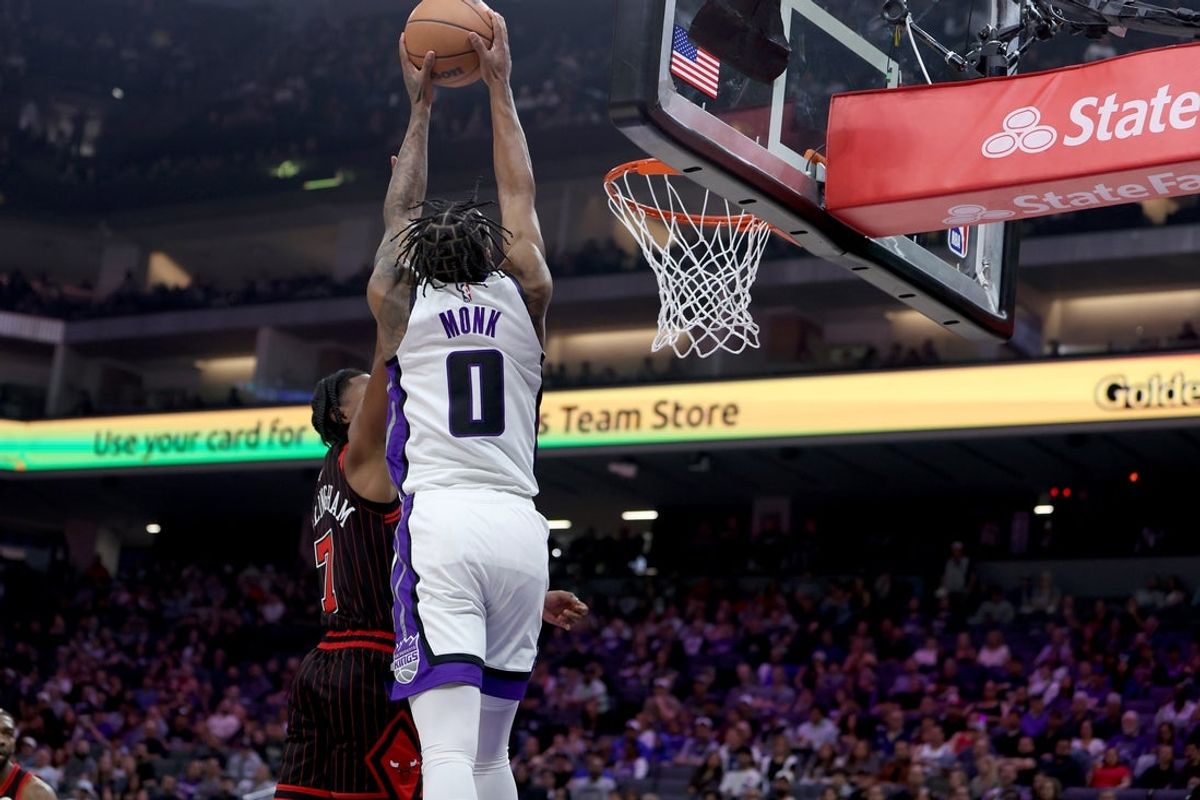 Mar 8, 2026; Sacramento, California, USA; Sacramento Kings guard Malik Monk (0) dunks the ball against the Chicago Bulls during the first quarter at Golden 1 Center. Mandatory Credit: Dennis Lee-Imagn Images