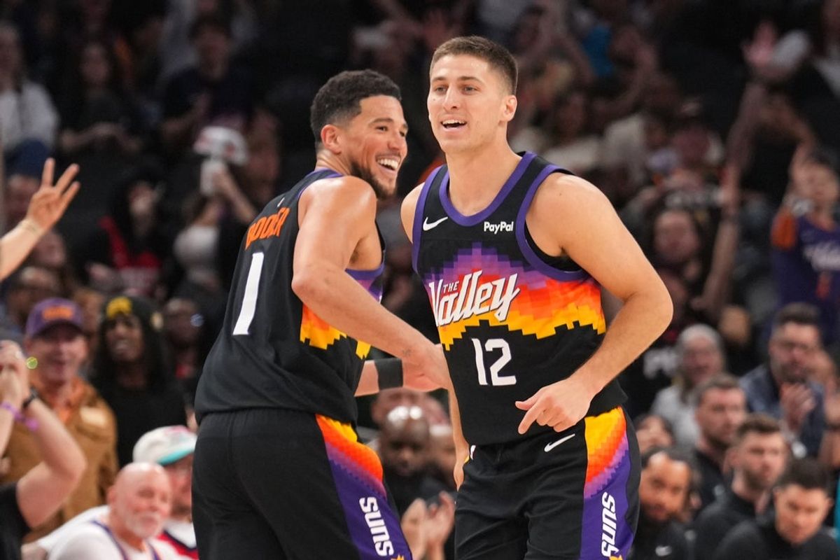 Mar 8, 2026; Phoenix, Arizona, USA; Phoenix Suns guard Devin Booker (1) and Phoenix Suns guard Collin Gillespie (12) react against the Charlotte Hornets during the second half at Mortgage Matchup Center. Mandatory Credit: Joe Camporeale-Imagn Images
