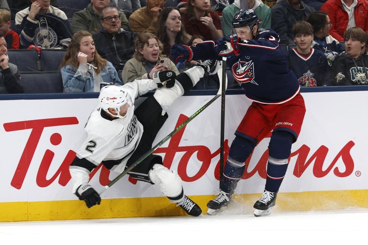 Mar 9, 2026; Columbus, Ohio, USA; Columbus Blue Jackets center Charlie Coyle (3) checks Los Angeles Kings defenseman Brian Dumoulin (2) during the second period at Nationwide Arena. Mandatory Credit: Russell LaBounty-Imagn Images