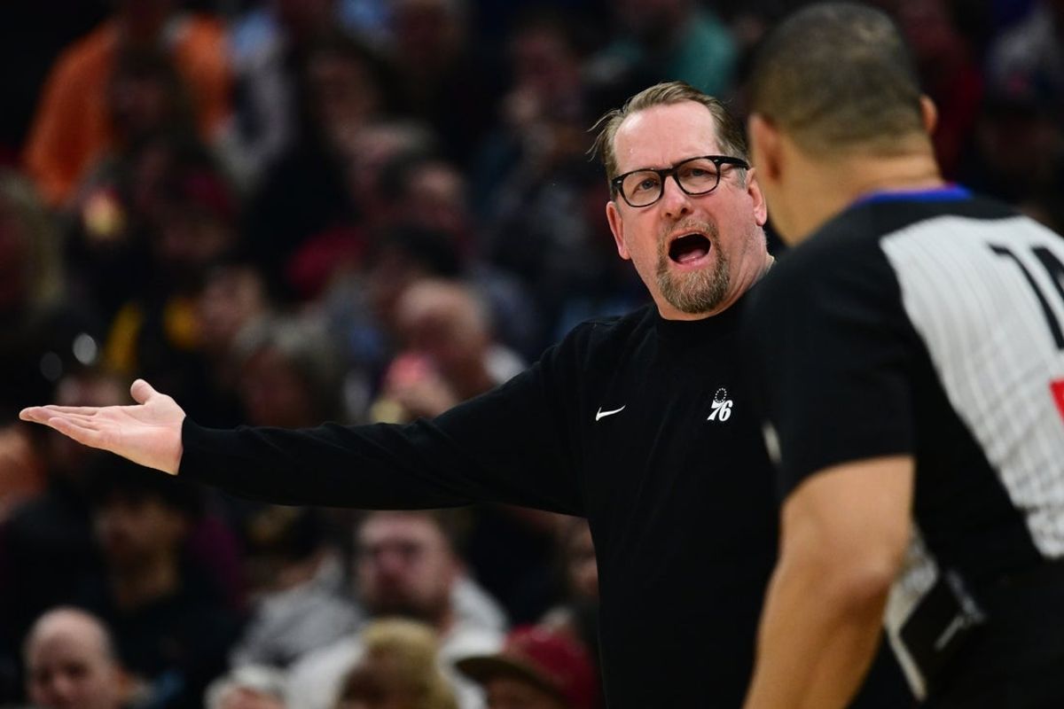 Mar 9, 2026; Cleveland, Ohio, USA; Philadelphia 76ers head coach Nick Nurse argues a call with referee Curtis Blair (74) during the first half against the Cleveland Cavaliers at Rocket Arena. Mandatory Credit: Ken Blaze-Imagn Images