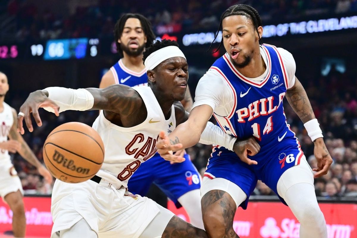 Mar 9, 2026; Cleveland, Ohio, USA; Philadelphia 76ers forward Dalen Terry (14) knocks the ball from Cleveland Cavaliers guard Dennis Schroder (8) during the second half at Rocket Arena. Mandatory Credit: Ken Blaze-Imagn Images