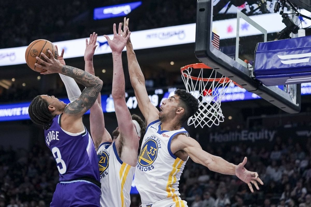 Mar 9, 2026; Salt Lake City, Utah, USA; Utah Jazz guard Keyonte George (3) goes up against Golden State Warriors center Quinten Post (21) and forward Malevy Leons (33) in the second quarter at Delta Center. Mandatory Credit: Gabriel Mayberry-Imagn Images