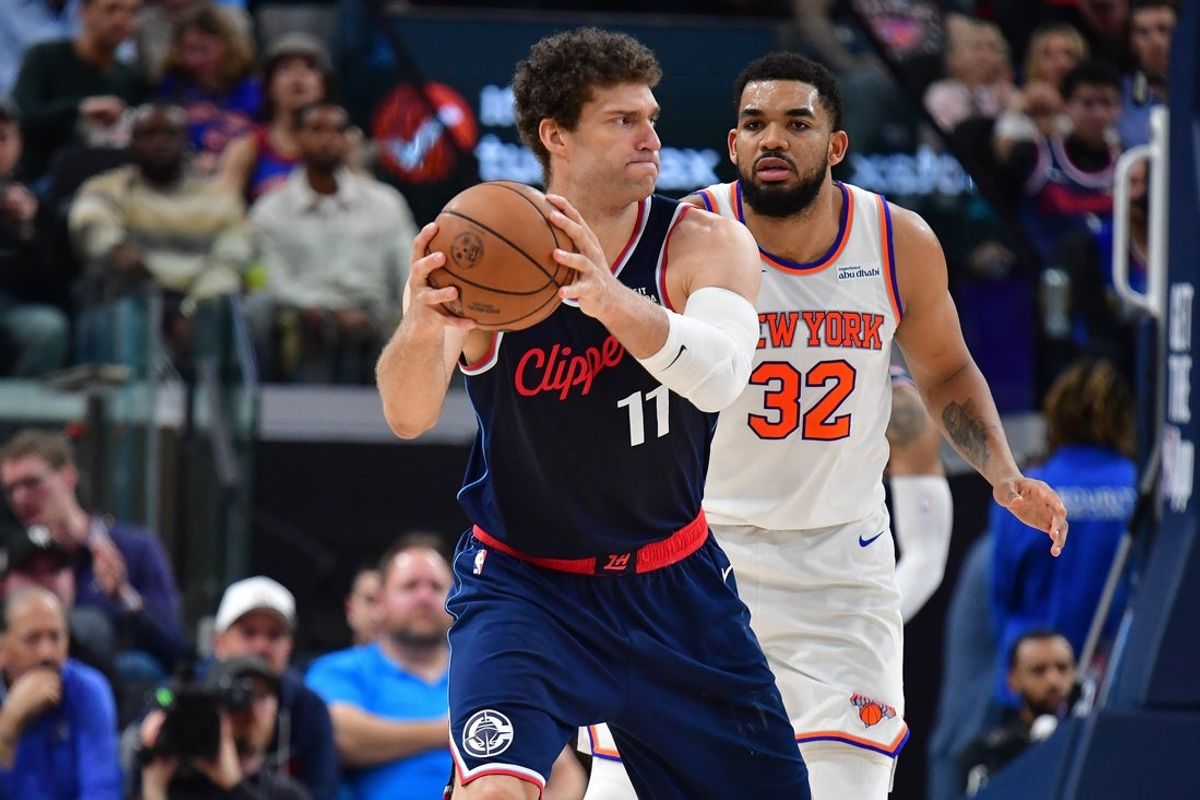 Mar 9, 2026; Inglewood, California, USA; Los Angeles Clippers center Brook Lopez (11) controls the ball against New York Knicks center Karl-Anthony Towns (32) during the first half at Intuit Dome. Mandatory Credit: Gary A. Vasquez-Imagn Images