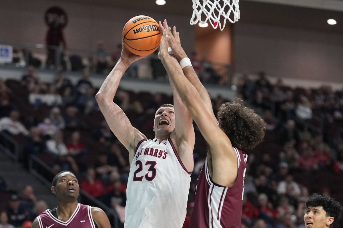 March 9, 2026; Las Vegas, NV, USA; Saint Mary's Gaels forward Paulius Murauskas (23) shoots the basketball against Santa Clara Broncos guard Thierry Darlan (15) during the second half at Orleans Arena. Mandatory Credit: Kyle Terada-Imagn Images