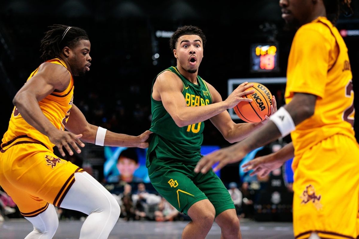 Mar 10, 2026; Kansas City, MO, USA; Baylor Bears guard Isaac Williams IV (10) drives around Arizona State Sun Devils forward Allen Mukeba (23) during the second half at T-Mobile Center. Mandatory Credit: William Purnell-Imagn Images