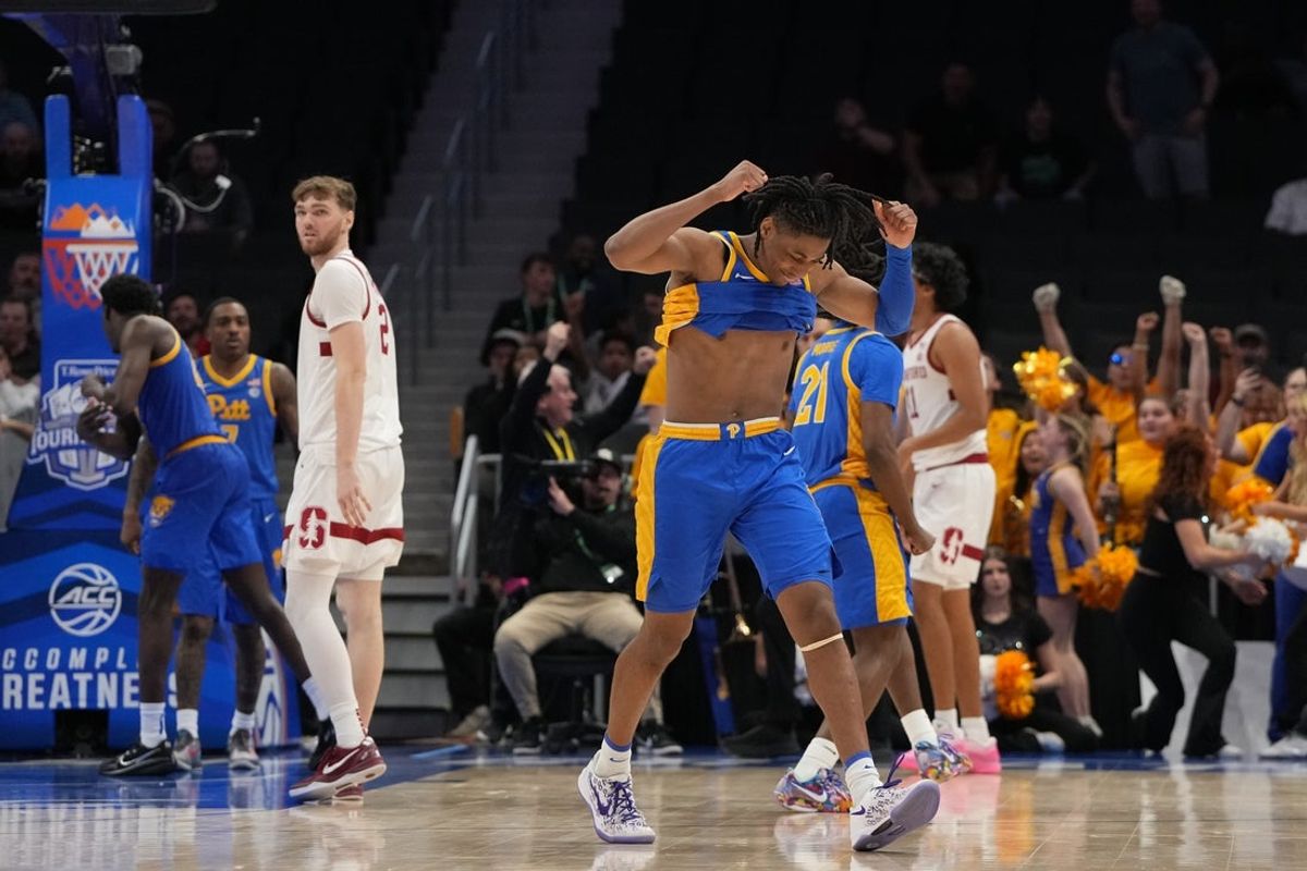 Mar 10, 2026; Charlotte, NC, USA; Pittsburgh Panthers guard Omari Witherspoon (8) celebrates after guard Damarco Minor (7) winning shot in the second half at Spectrum Center. Mandatory Credit: Bob Donnan-Imagn Images
