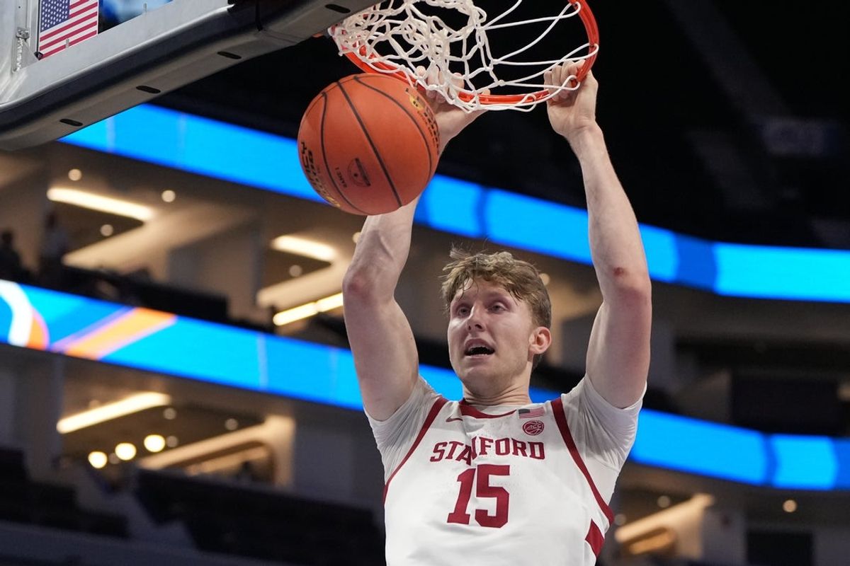 Mar 10, 2026; Charlotte, NC, USA; Stanford Cardinal forward Oskar Giltay (15) scores in the second half at Spectrum Center. Mandatory Credit: Bob Donnan-Imagn Images