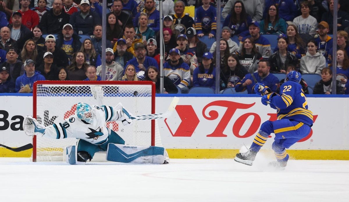 Mar 10, 2026; Buffalo, New York, USA;  Buffalo Sabres right wing Jack Quinn (22) scores a goal on San Jose Sharks goaltender Yaroslav Askarov (30) during the first period at KeyBank Center. Mandatory Credit: Timothy T. Ludwig-Imagn Images