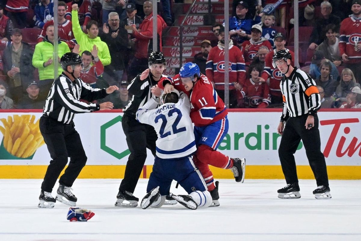 Mar 10, 2026; Montreal, Quebec, CAN; Montreal Canadiens forward Brendan Gallagher (11) fights with Toronto Maple Leafs defenseman Jake McCabe (22) during the first period at the Bell Centre. Mandatory Credit: Eric Bolte-Imagn Images