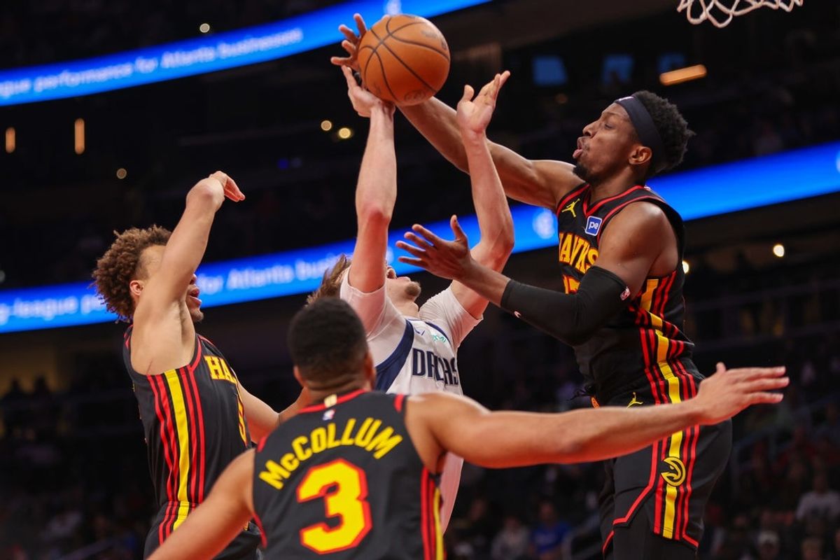 Mar 10, 2026; Atlanta, Georgia, USA; Atlanta Hawks forward Onyeka Okongwu (17) blocks the shot of Dallas Mavericks forward Cooper Flagg (32) in the first quarter at State Farm Arena. Mandatory Credit: Brett Davis-Imagn Images