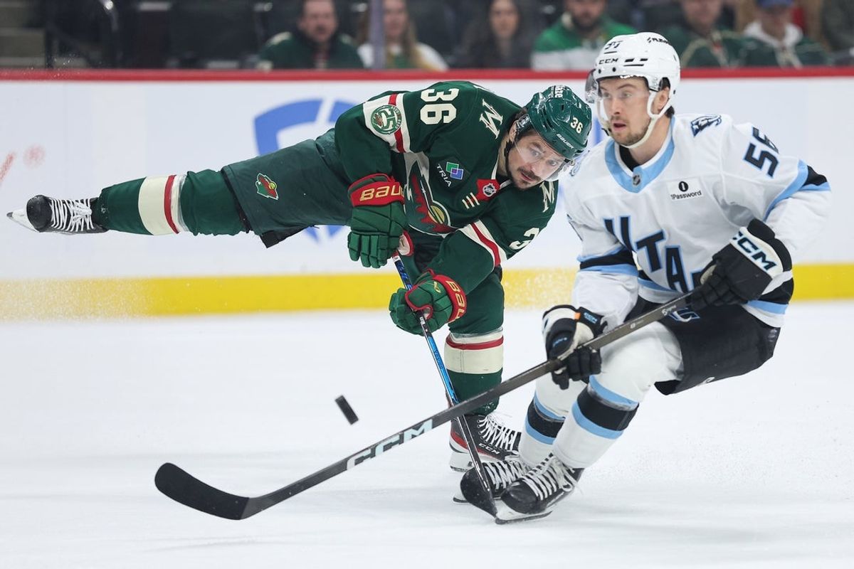 Mar 10, 2026; Saint Paul, Minnesota, USA; Minnesota Wild right wing Mats Zuccarello (36) and Utah Mammoth right wing Kailer Yamamoto (56) compete for the puck during the first period at Grand Casino Arena. Mandatory Credit: Matt Krohn-Imagn Images