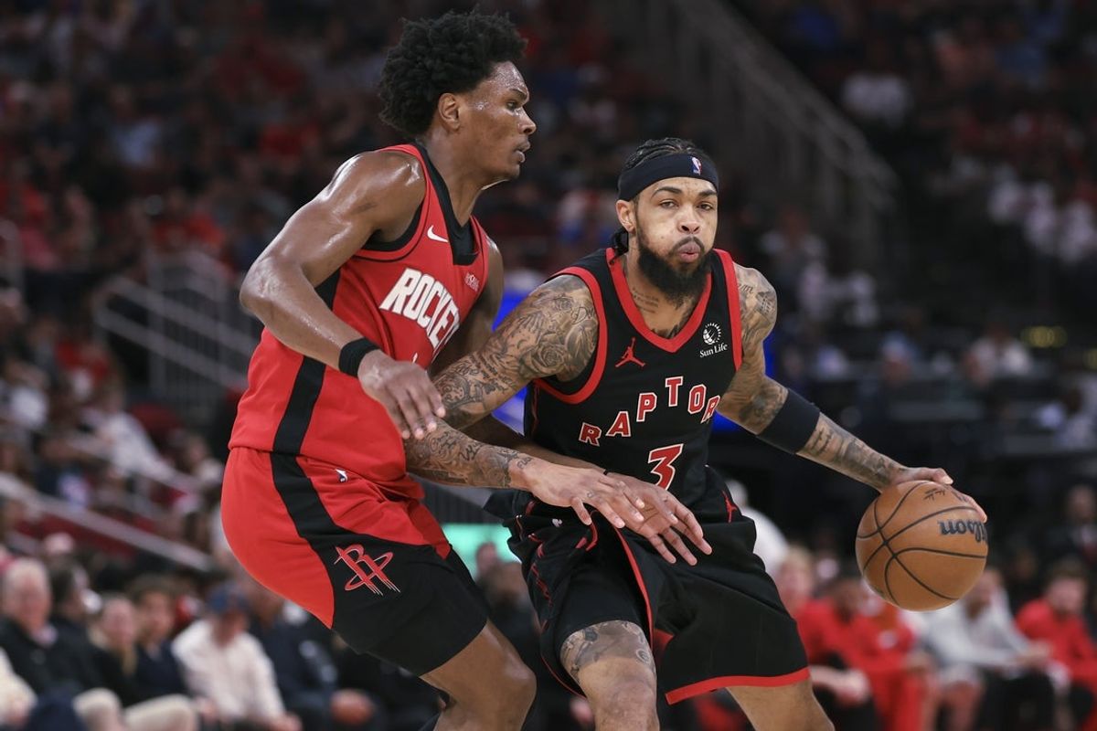 Mar 10, 2026; Houston, Texas, USA; Toronto Raptors forward Brandon Ingram (3) dribbles the ball as Houston Rockets guard Amen Thompson (1) defends during the second quarter at Toyota Center. Mandatory Credit: Troy Taormina-Imagn Images