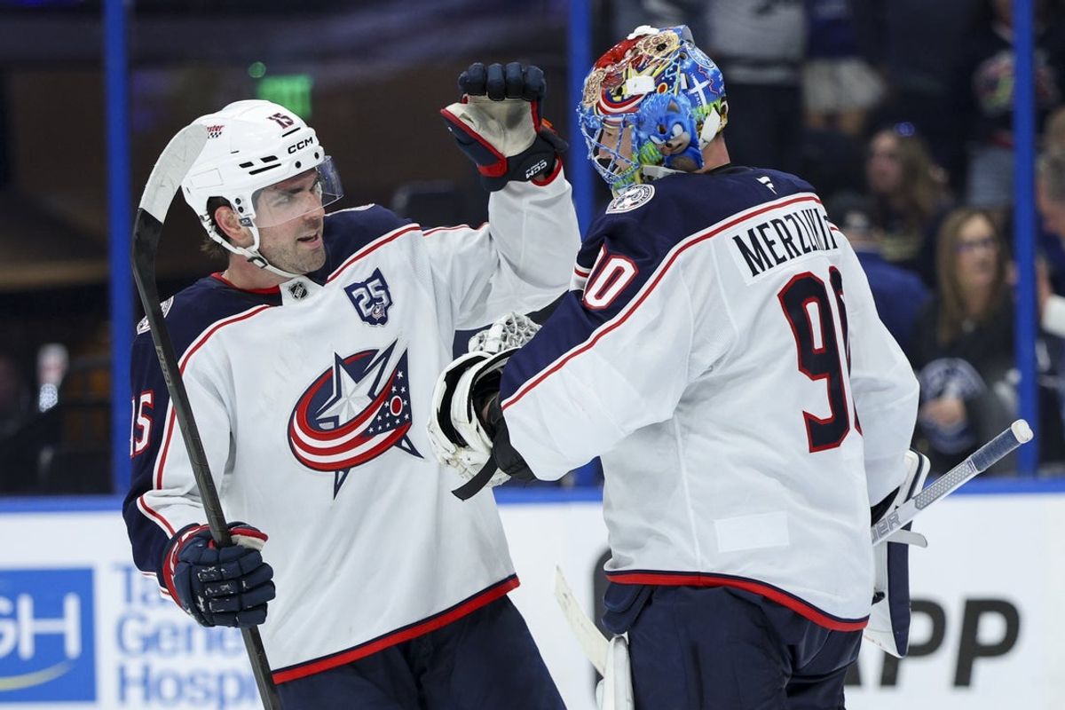 Mar 10, 2026; Tampa, Florida, USA; Columbus Blue Jackets goaltender Elvis Merzlikins (90) and defenseman Dante Fabbro (15) react after beating the Tampa Bay Lightning in the third period at Benchmark International Arena. Mandatory Credit: Nathan Ray Seebeck-Imagn Images
