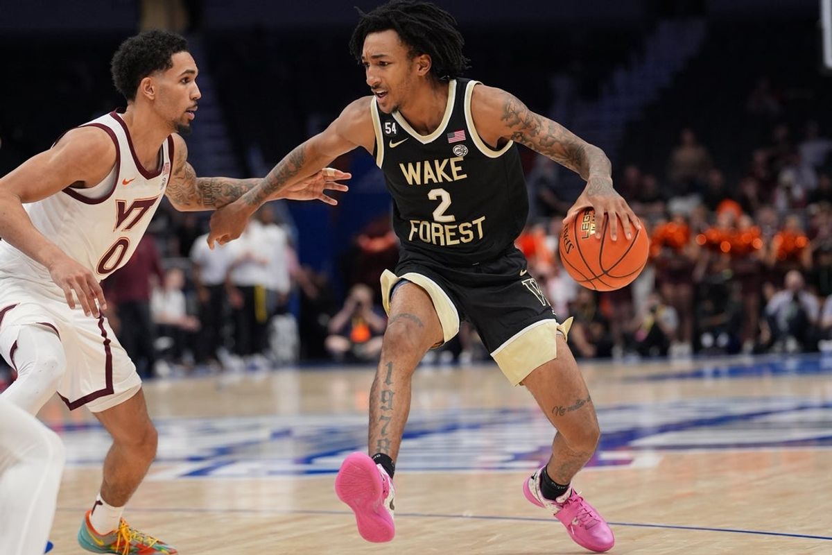 Mar 10, 2026; Charlotte, NC, USA; Wake Forest Demon Deacons forward Juke Harris (2) dribbles the ball against Virginia Tech Hokies guard Jailen Bedford (0) during the second half at Spectrum Center. Mandatory Credit: Jim Dedmon-Imagn Images