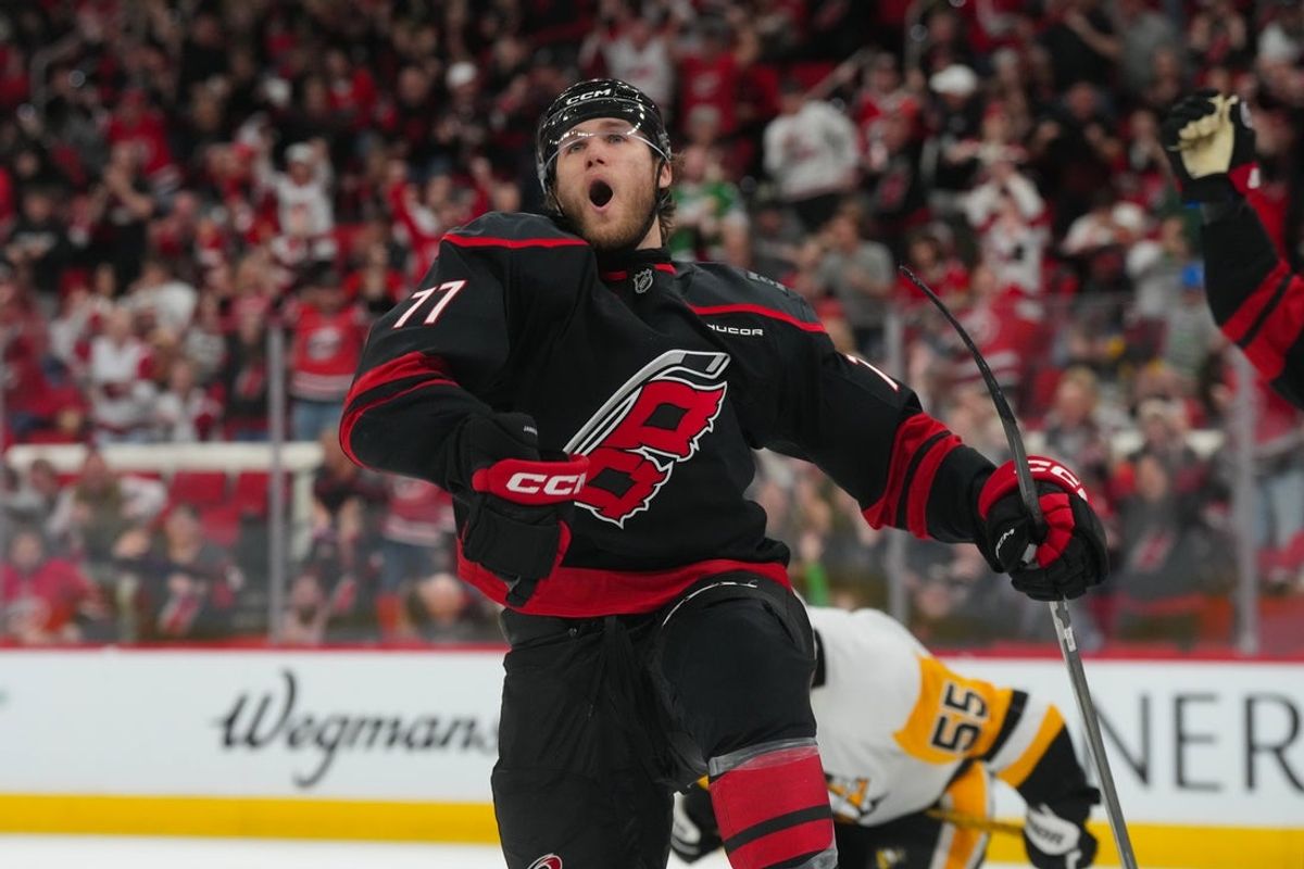 Mar 10, 2026; Raleigh, North Carolina, USA;  Carolina Hurricanes left wing Mark Jankowski (77) celebrates his goal against the Pittsburgh Penguins during the third period at Lenovo Center. Mandatory Credit: James Guillory-Imagn Images
