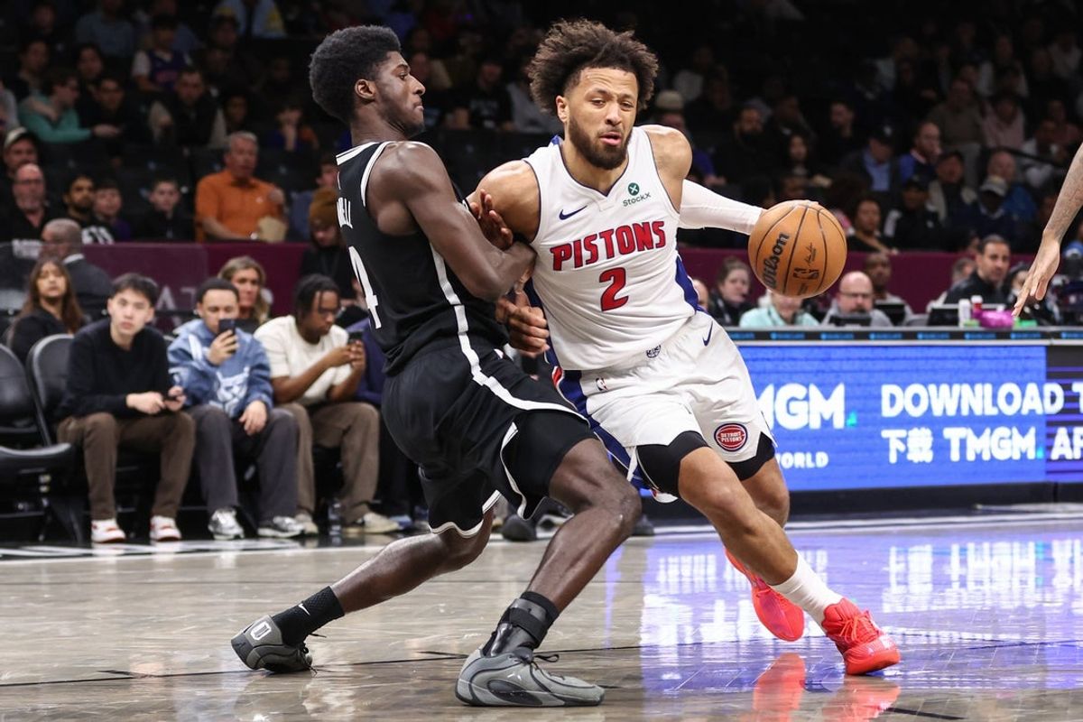 Mar 10, 2026; Brooklyn, New York, USA;  Detroit Pistons guard Cade Cunningham (2) looks to drive past Brooklyn Nets guard Drake Powell (4) in the third quarter at Barclays Center. Mandatory Credit: Wendell Cruz-Imagn Images