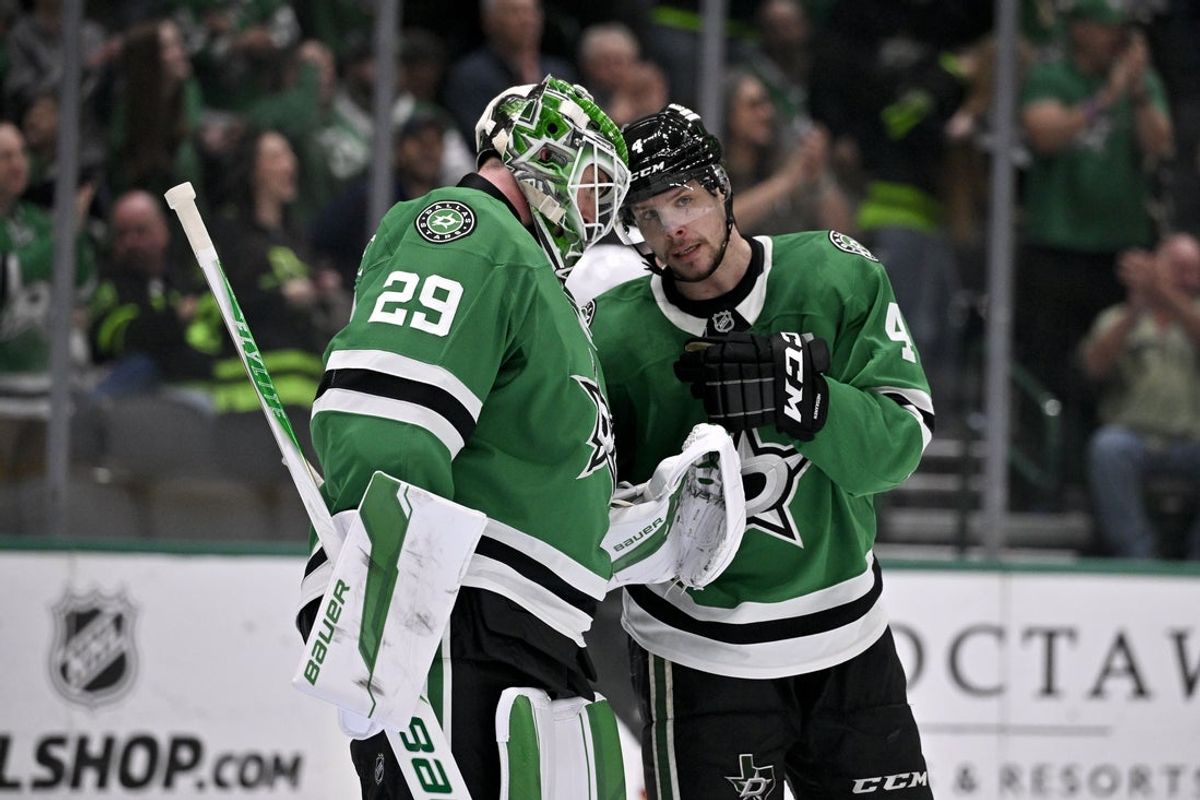 Mar 10, 2026; Dallas, Texas, USA; Dallas Stars goaltender Jake Oettinger (29) and defenseman Miro Heiskanen (4) celebrate on the ice after the victory over the Vegas Golden Knights at the American Airlines Center. Mandatory Credit: Jerome Miron-Imagn Images