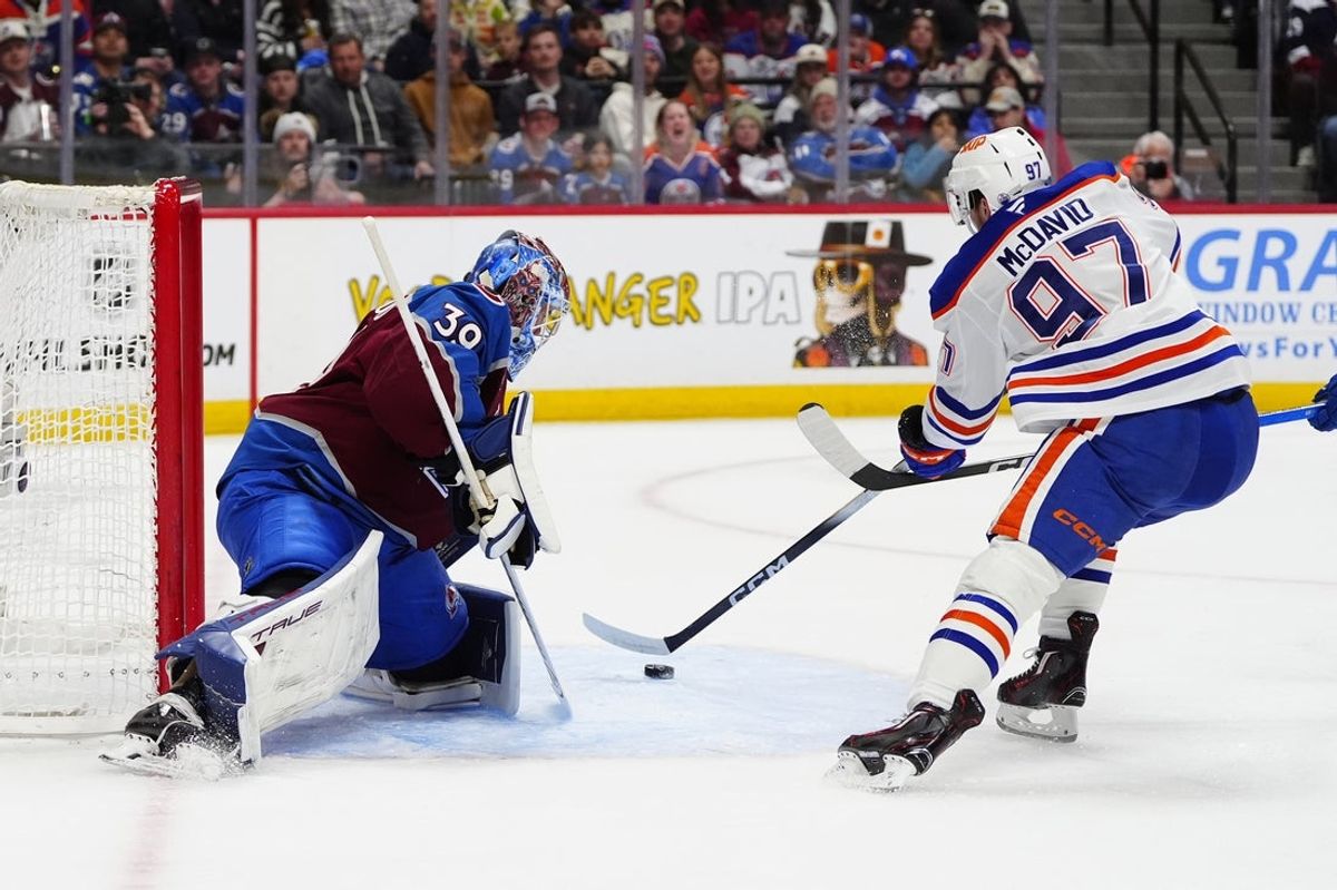 Mar 10, 2026; Denver, Colorado, USA; Colorado Avalanche goaltender MacKenzie Blackwood (39) defends on Edmonton Oilers center Connor McDavid (97) in the first period at Ball Arena. Mandatory Credit: Ron Chenoy-Imagn Images