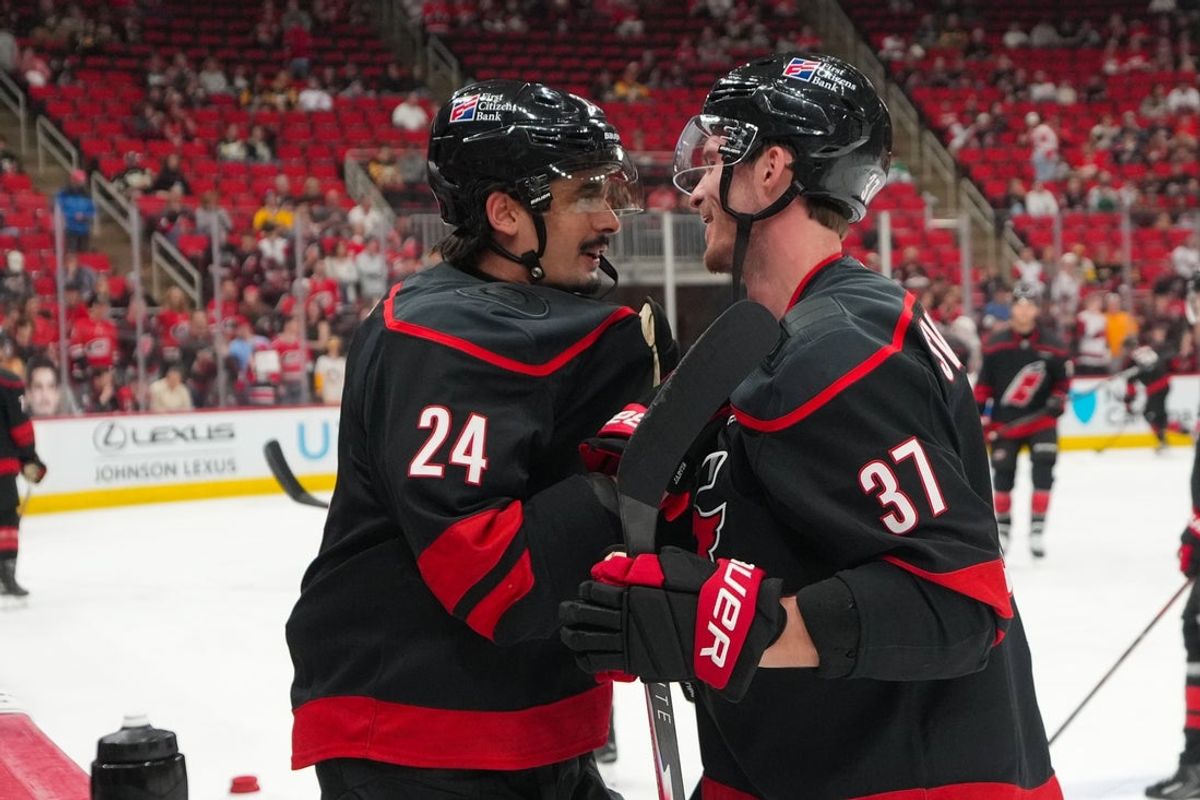 Mar 10, 2026; Raleigh, North Carolina, USA;  Carolina Hurricanes center Seth Jarvis (24) and right wing Andrei Svechnikov (37) look at each other during the warmups before the game against the Pittsburgh Penguins at Lenovo Center. Mandatory Credit: James Guillory-Imagn Images