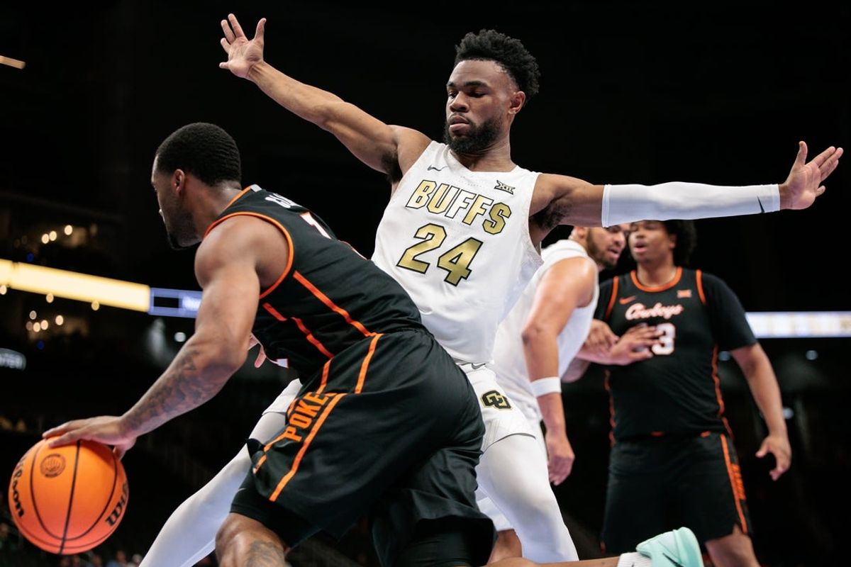 Mar 10, 2026; Kansas City, MO, USA; Colorado Buffaloes guard Barrington Hargress (24) guards Oklahoma State Cowboys guard Kanye Clary (1) during the second half at T-Mobile Center. Mandatory Credit: William Purnell-Imagn Images