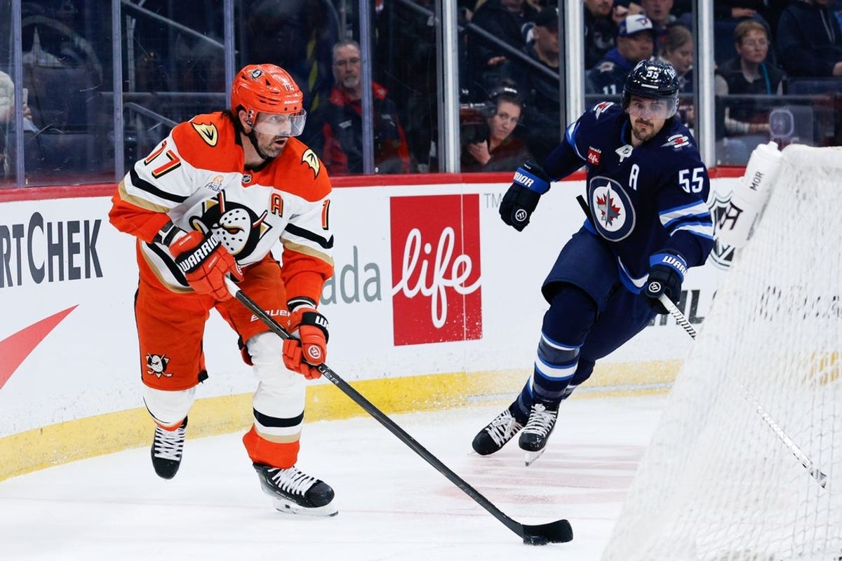 Mar 10, 2026; Winnipeg, Manitoba, CAN;  Anaheim Ducks forward Alex Killorn (17) skates away from Winnipeg Jets forward Mark Scheifele (55) during the third period at Canada Life Centre. Mandatory Credit: Terrence Lee-Imagn Images