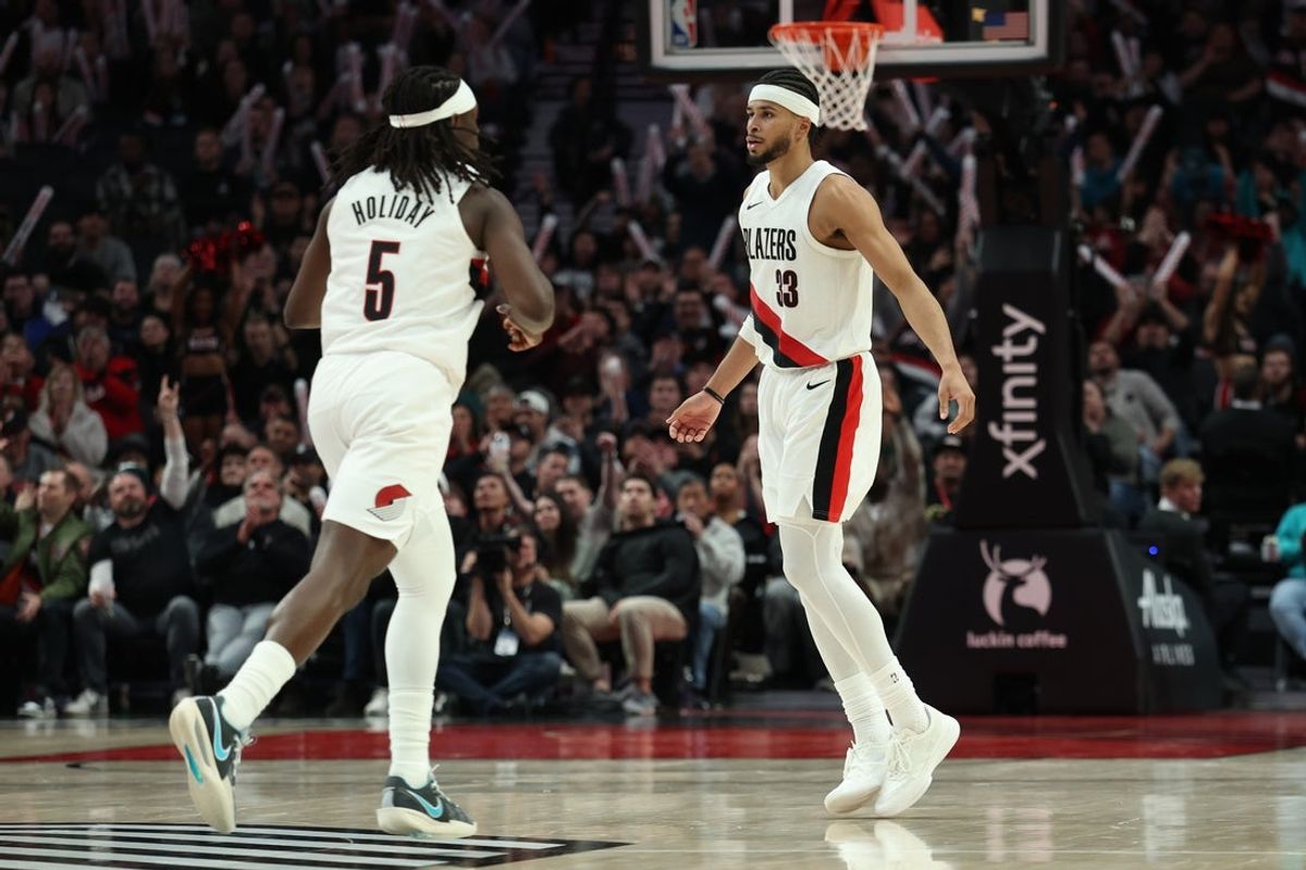 Mar 10, 2026; Portland, Oregon, USA;  Portland Trail Blazers forward Toumani Camara (33) runs back on defense with guard Jrue Holiday (5) against the Charlotte Hornets during the second half at Moda Center. Mandatory Credit: Jaime Valdez-Imagn Images