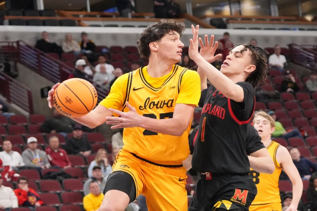 Mar 11, 2026; Chicago, IL, USA; Maryland Terrapins guard Darius Adams (1) defends Iowa Hawkeyes guard Isaia Howard (23) during the first half at United Center. Mandatory Credit: David Banks-Imagn Images