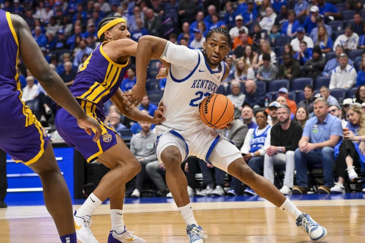 Mar 11, 2026; Nashville, TN, USA;  Kentucky Wildcats forward Mouhamed Dioubate (23) backs down Louisiana State Tigers forward Pablo Tamba (8) during the first half at Bridgestone Arena. Mandatory Credit: Steve Roberts-Imagn Images