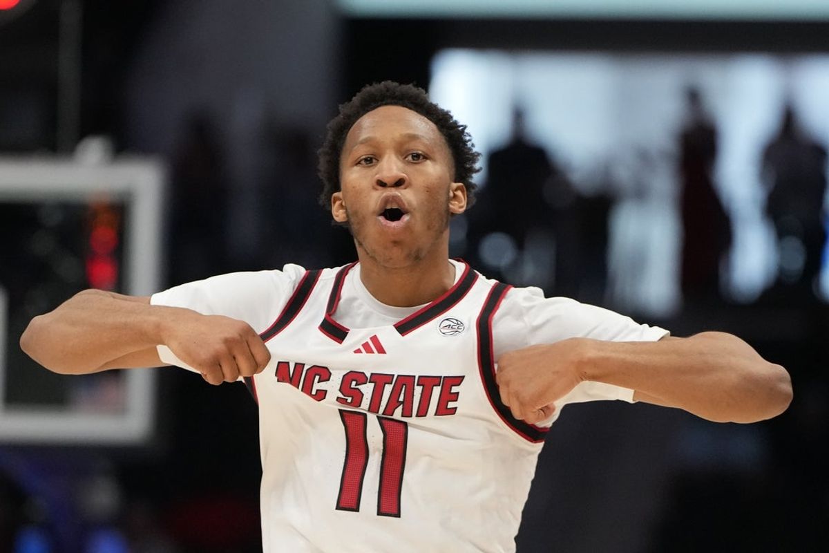 Mar 11, 2026; Charlotte, NC, USA; NC State Wolfpack guard Quadir Copeland (11) reacts after scoring in the second half at Spectrum Center. Mandatory Credit: Bob Donnan-Imagn Images