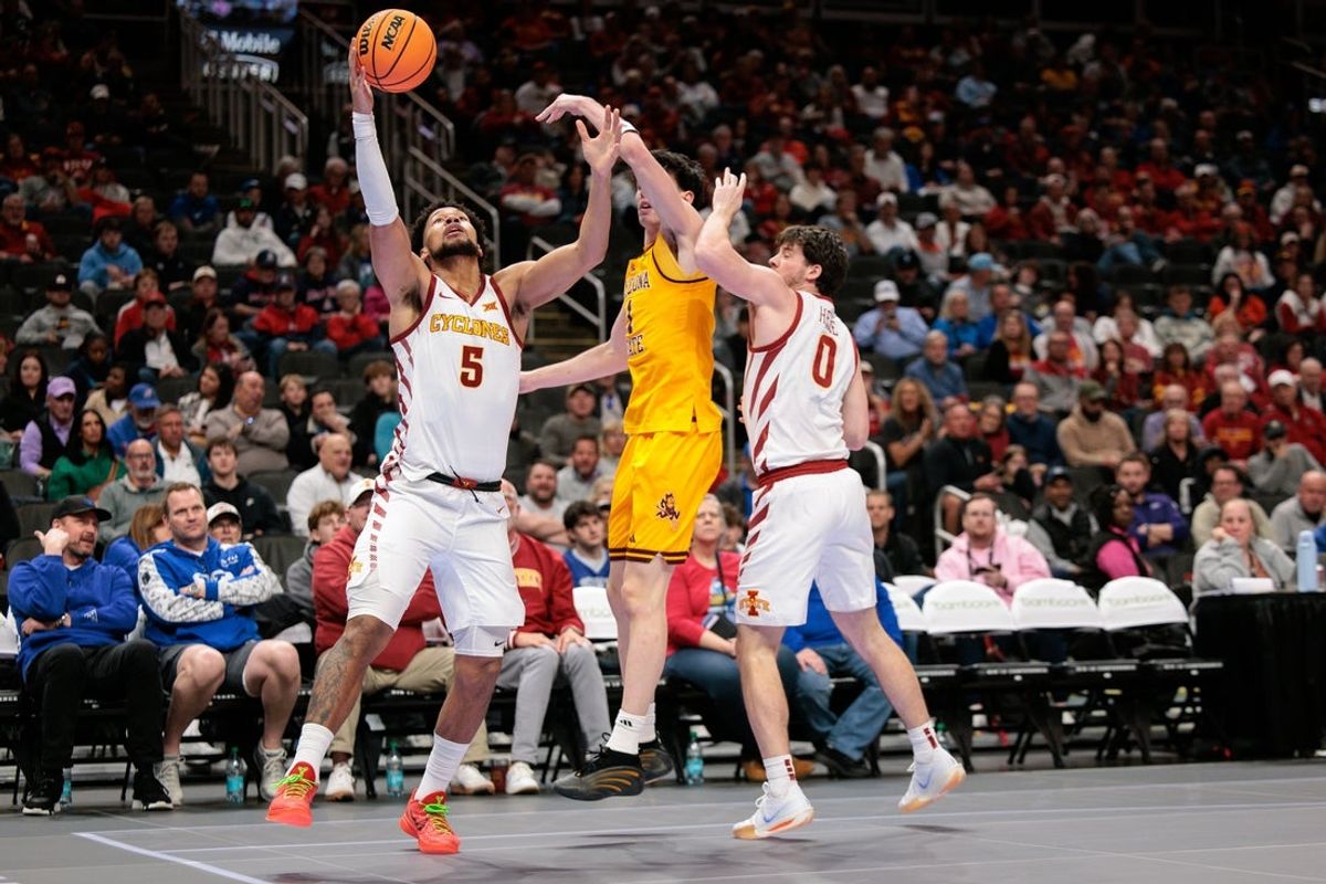 Mar 11, 2026; Kansas City, MO, USA; Iowa State Cyclones forward Joshua Jefferson (5) grabs a loose ball in front of Arizona State Sun Devils forward Santiago Trouet (1) and Iowa State Cyclones guard Nate Heise (0) during the second half at T-Mobile Center. Mandatory Credit: William Purnell-Imagn Images