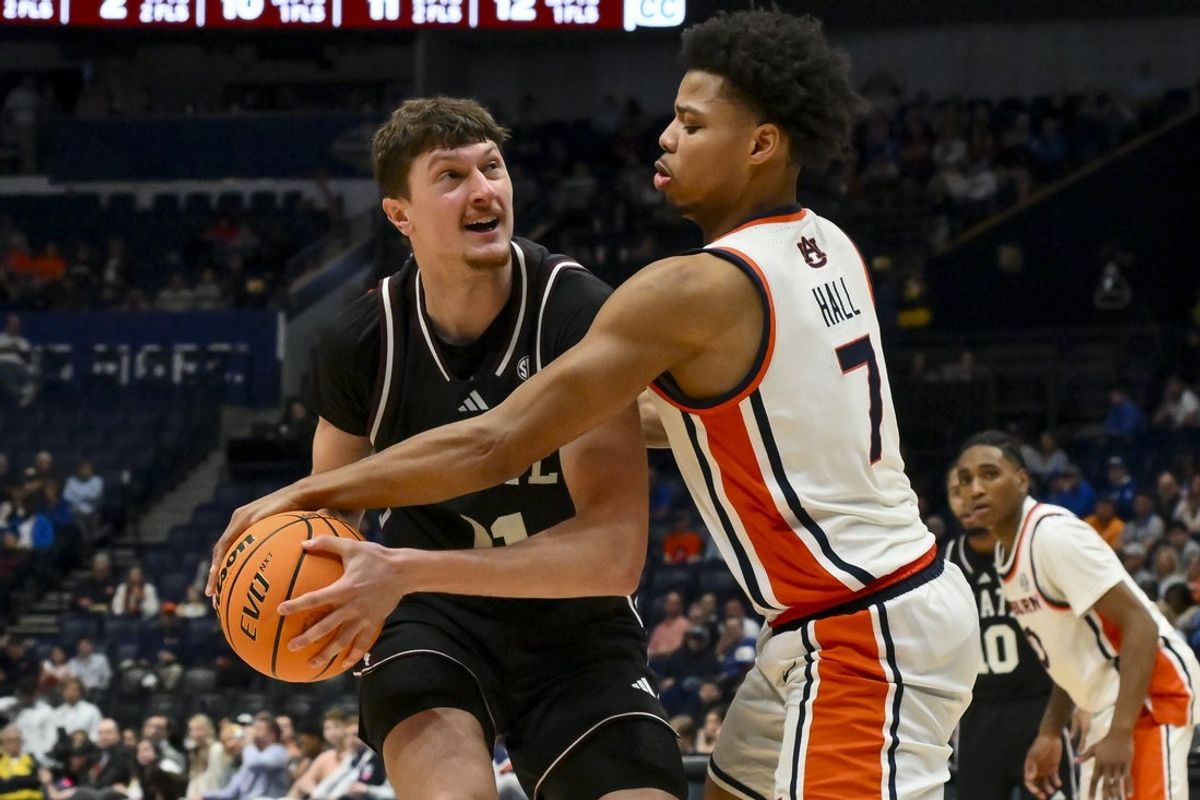 Mar 11, 2026; Nashville, TN, USA;  Auburn Tigers guard Keyshawn Hall (7) strips the ball from Mississippi State Bulldogs forward Sergej Macura (11) during the second half at Bridgestone Arena. Mandatory Credit: Steve Roberts-Imagn Images