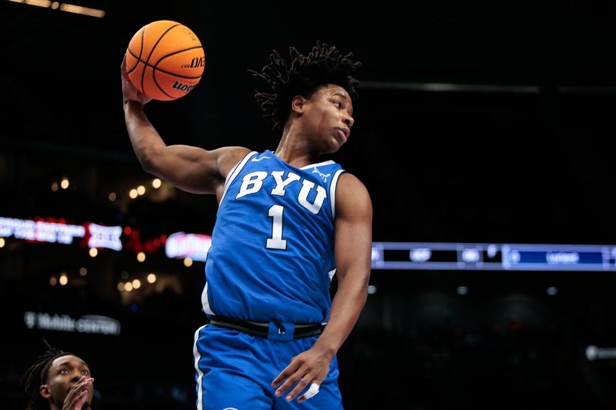 Mar 11, 2026; Kansas City, MO, USA; BYU Cougars guard Robert Wright III (1) rebounds during the first half against the West Virginia Mountaineers at T-Mobile Center. Mandatory Credit: William Purnell-Imagn Images