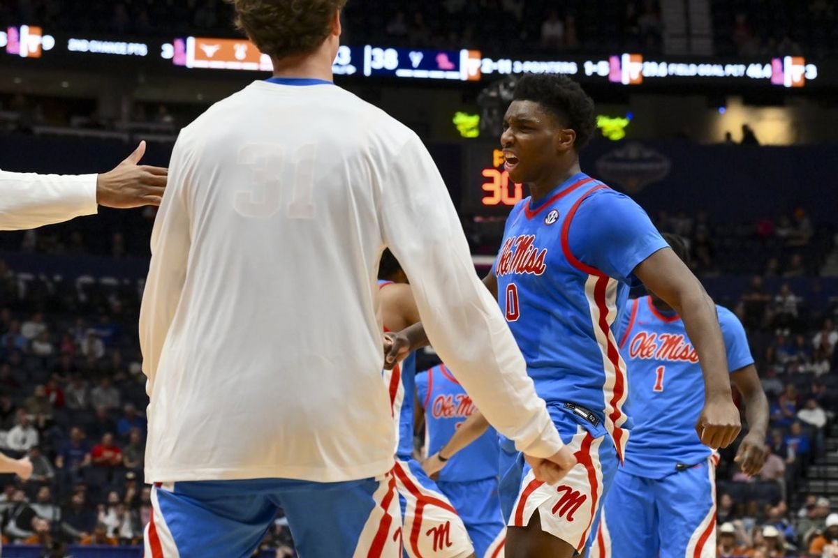 Mar 11, 2026; Nashville, TN, USA;  Mississippi Rebels forward Malik Dia (0) celebrates after Texas Longhorns call time out during the first half at Bridgestone Arena. Mandatory Credit: Steve Roberts-Imagn Images