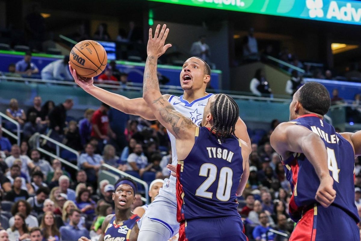 Mar 11, 2026; Orlando, Florida, USA; Orlando Magic guard Desmond Bane (3) goes to the basket against Cleveland Cavaliers guard Jaylon Tyson (20) during the second quarter at Kia Center. Mandatory Credit: Mike Watters-Imagn Images