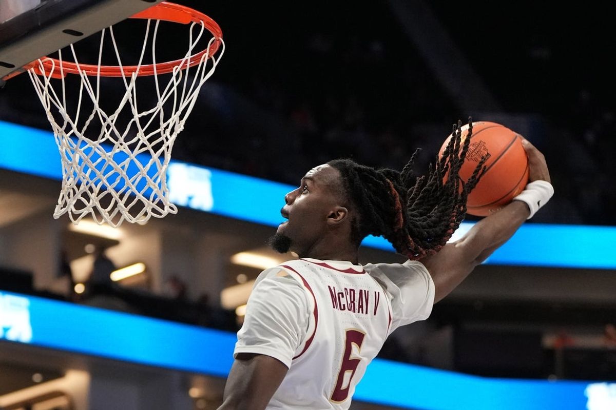 Mar 11, 2026; Charlotte, NC, USA; Florida State Seminoles guard Robert McCray V. (6) scores in the second half at Spectrum Center. Mandatory Credit: Bob Donnan-Imagn Images