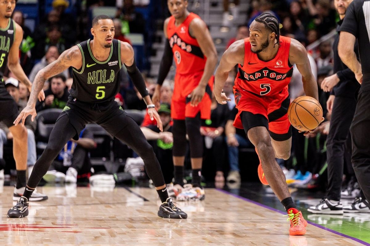 Mar 11, 2026; New Orleans, Louisiana, USA;  Toronto Raptors guard Immanuel Quickley (5) dribbles against New Orleans Pelicans guard Dejounte Murray (5) during the first half at Smoothie King Center. Mandatory Credit: Stephen Lew-Imagn Images