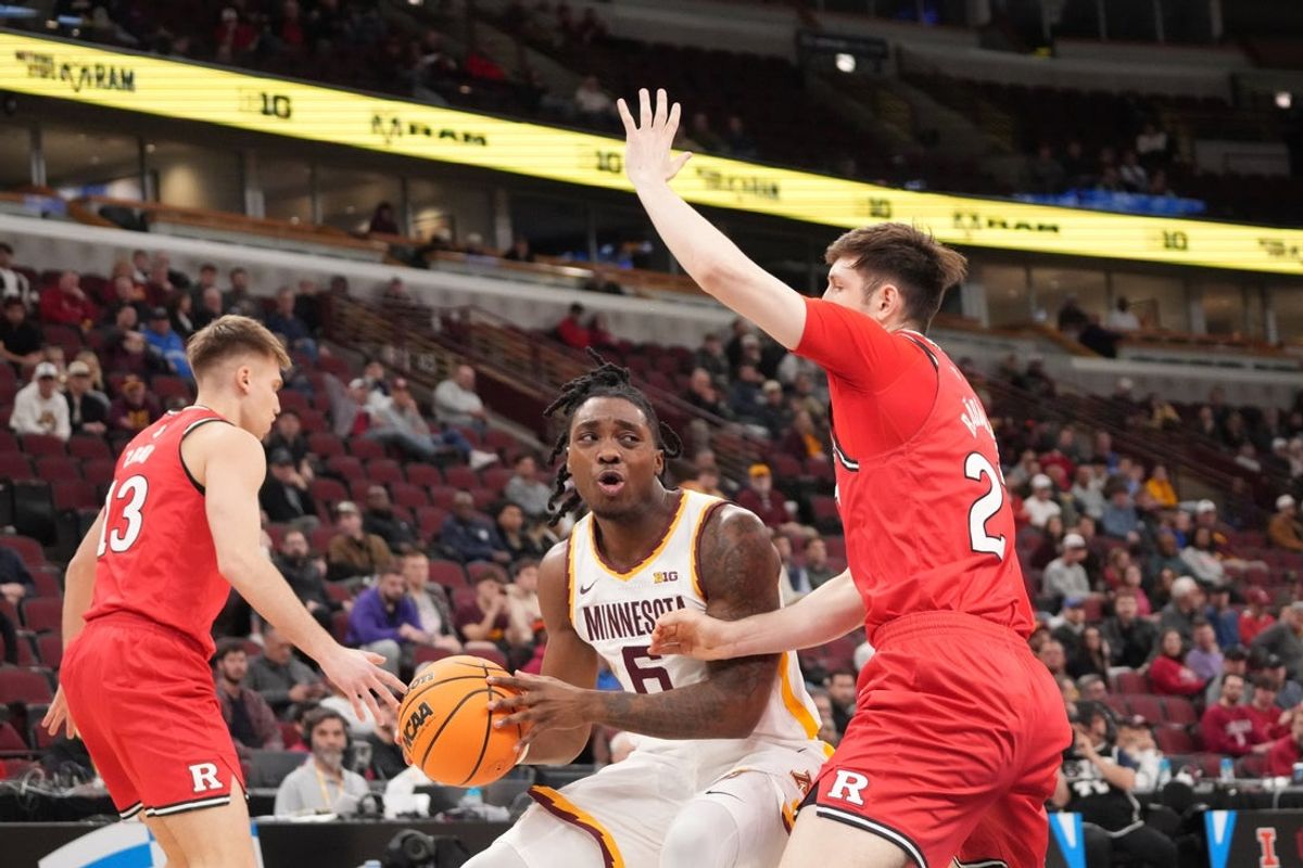 Mar 11, 2026; Chicago, IL, USA; Rutgers Scarlet Knights forward Denis Badalau (27) defends Minnesota Golden Gophers guard Langston Reynolds (6) during the first half at United Center. Mandatory Credit: David Banks-Imagn Images