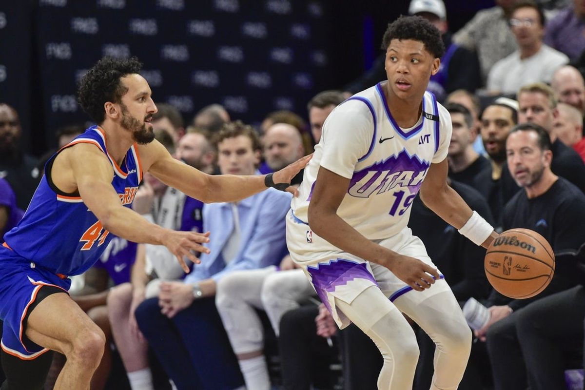 Mar 11, 2026; Salt Lake City, Utah, USA; Utah Jazz forward Ace Bailey (19) looks to pass around New York Knicks guard Landry Shamet (44) during the first half at Delta Center. Mandatory Credit: Peter Creveling-Imagn Images