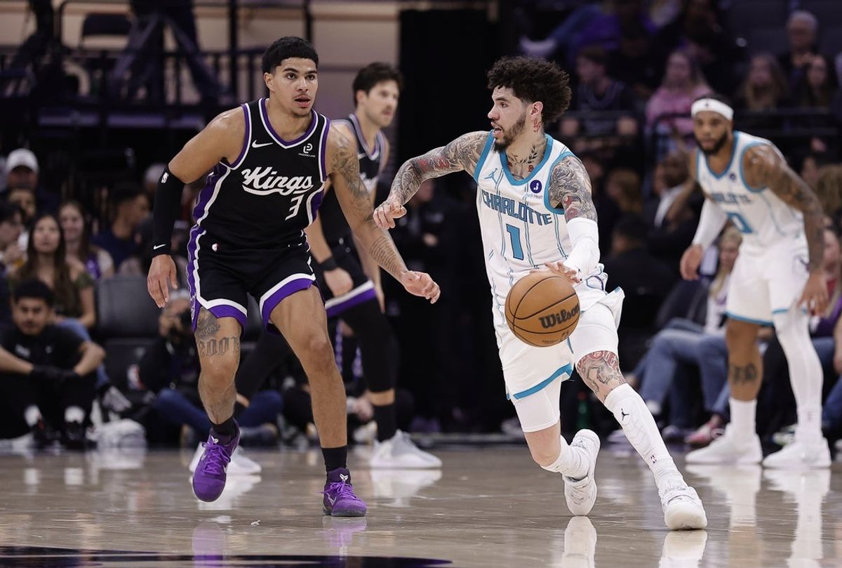 Mar 11, 2026; Sacramento, California, USA; Charlotte Hornets guard LaMelo Ball (1) controls the ball against Sacramento Kings guard Killian Hayes (3) during the second quarter at Golden 1 Center. Mandatory Credit: Kelley L Cox-Imagn Images