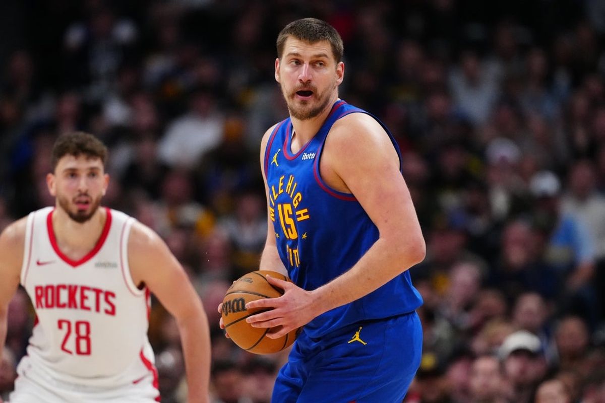 Mar 11, 2026; Denver, Colorado, USA; Denver Nuggets center Nikola Jokic (15)  controls the ball in the second quarter against the Houston Rockets at Ball Arena. Mandatory Credit: Ron Chenoy-Imagn Images