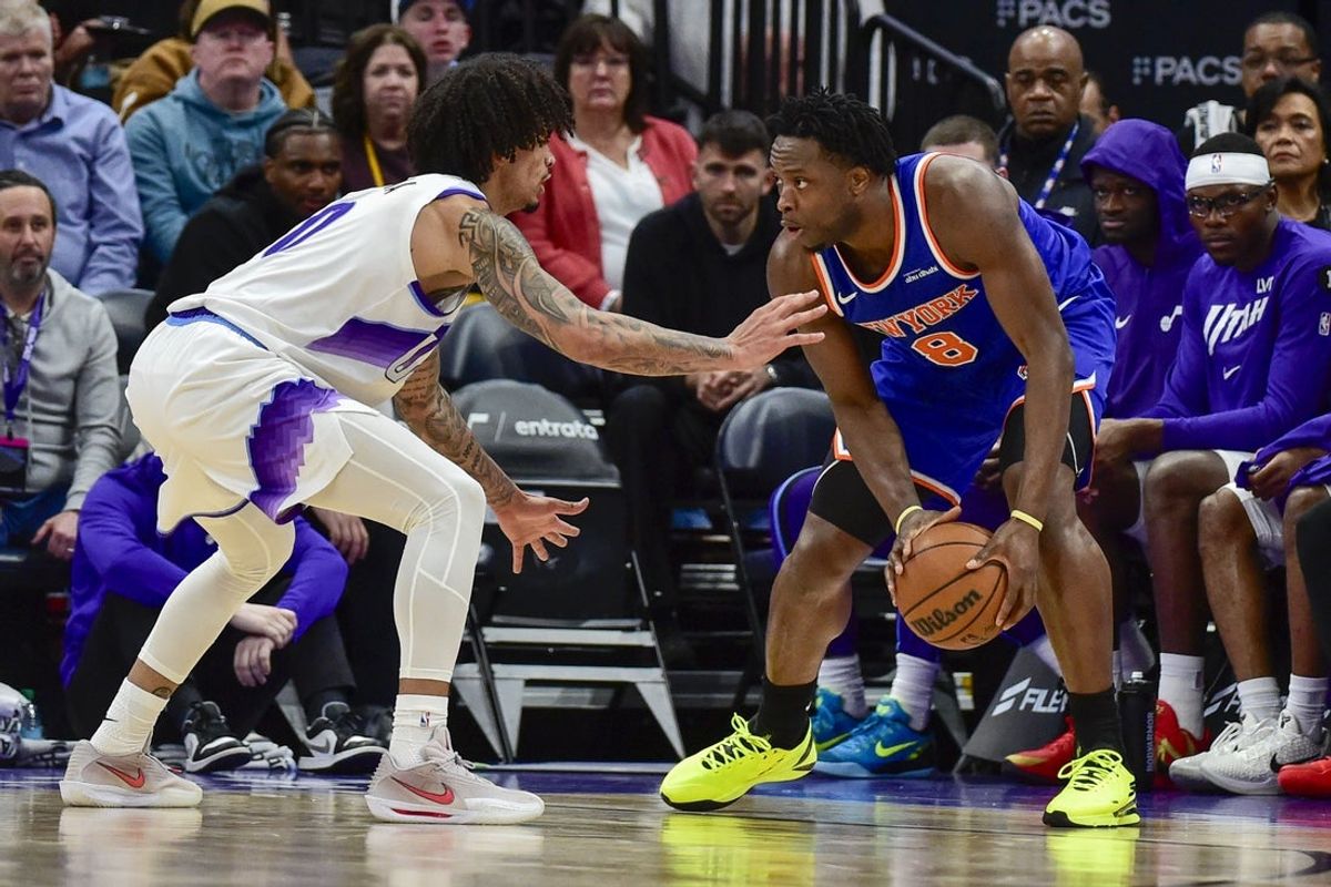 Mar 11, 2026; Salt Lake City, Utah, USA; New York Knicks forward/guard OG Anunoby (8) dribbles the ball against Utah Jazz forward Andersson Garcia (0) during the second half at Delta Center. Mandatory Credit: Peter Creveling-Imagn Images