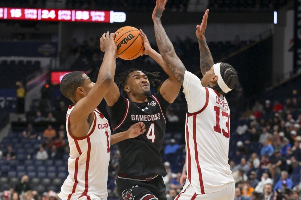Mar 11, 2026; Nashville, TN, USA;  Oklahoma Sooners guard Xzayvier Brown (1) and forward Tae Davis (13) blocks the shot of South Carolina Gamecocks guard Kobe Knox (4) during the second half at Bridgestone Arena. Mandatory Credit: Steve Roberts-Imagn Images